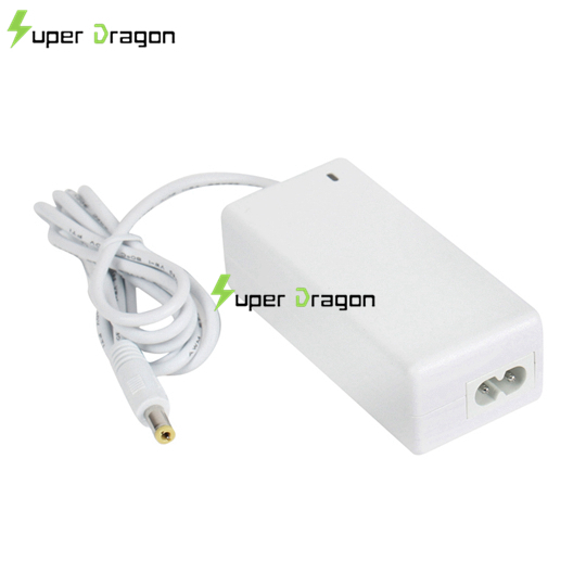 What is the consequence of using a lower wattage power adapter with a laptop?
