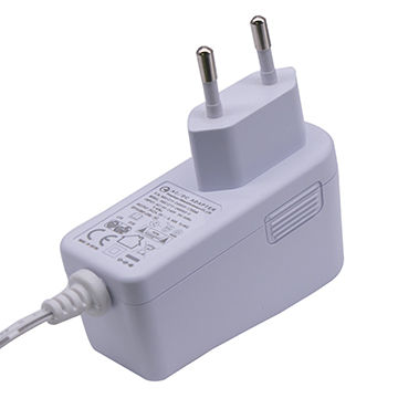 Why do different countries use different power adapters?